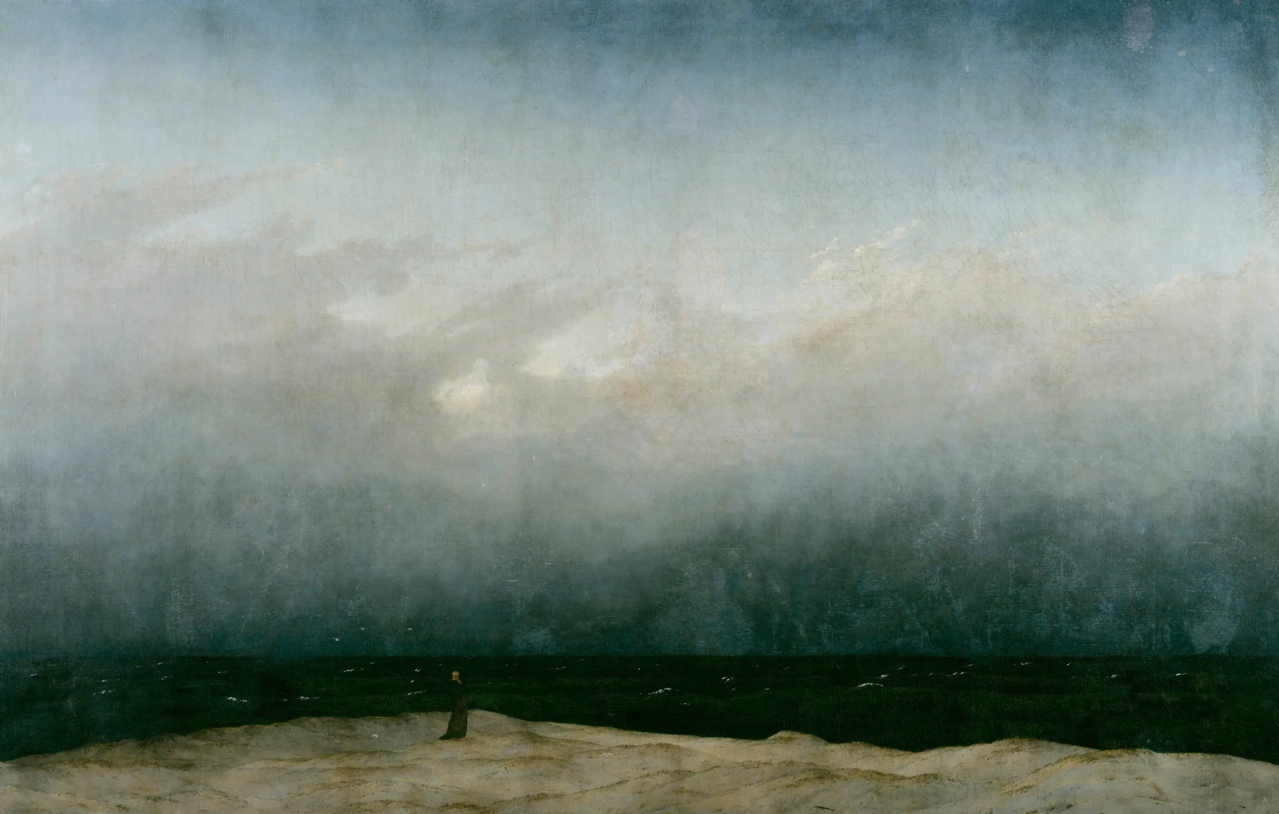 Casper David Friedrich's The Monk by the Sea, a solitary figure standing before a vast sea and sky.
